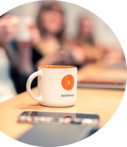 A Bold Orange branded coffee mug on a table